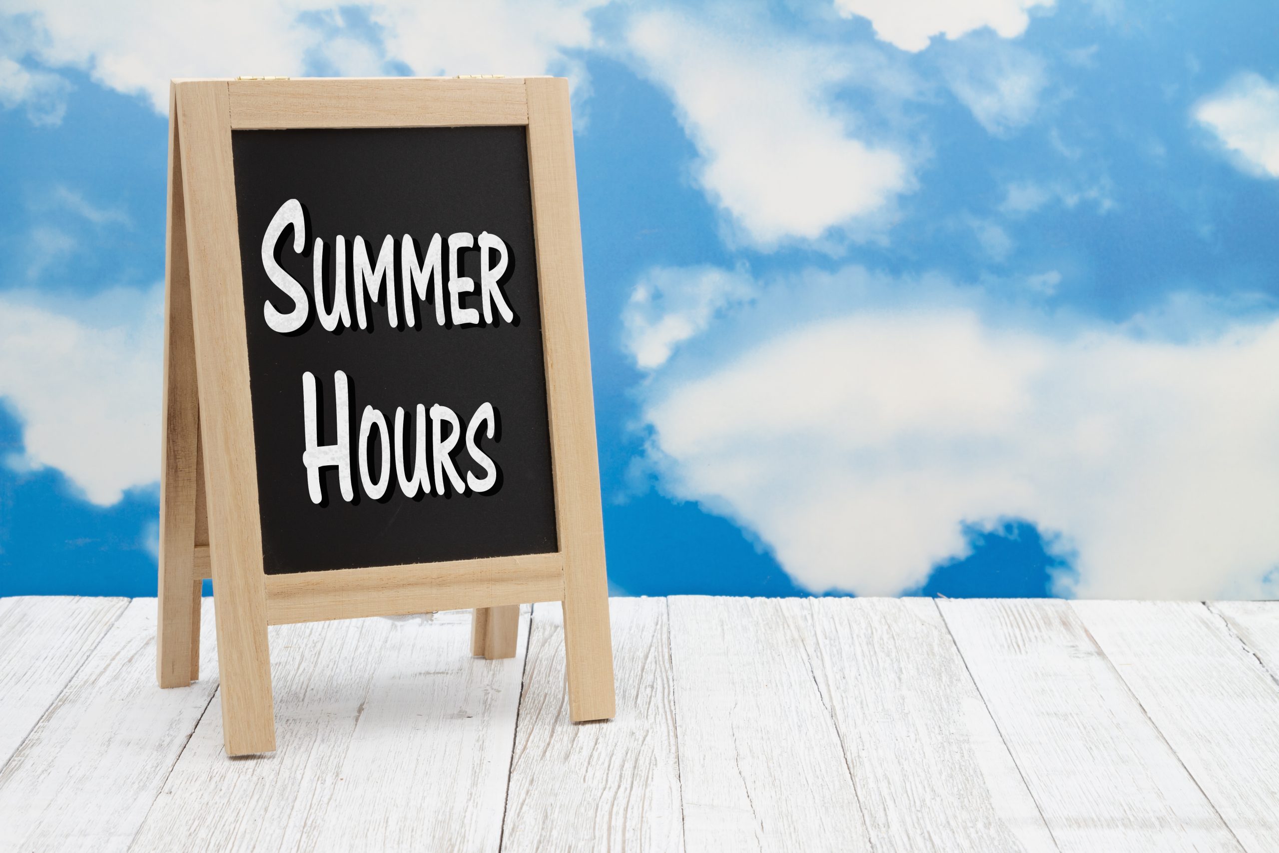 Summer,Hours,Sign,On,Standing,Chalkboard,On,Weathered,Wood,With